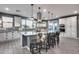 A modern kitchen features a large center island and stainless steel appliances at 32359 N 129Th Dr, Peoria, AZ 85383