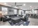Living room with gray color palette and view into the kitchen area at 32359 N 129Th Dr, Peoria, AZ 85383