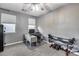 The office features a ceiling fan, desk area and fitness equipment for your workouts at 32359 N 129Th Dr, Peoria, AZ 85383