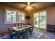 Outdoor covered patio with ceiling fan and dining near the kitchen at 32359 N 129Th Dr, Peoria, AZ 85383