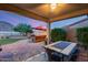 Inviting outdoor living area features a stylish table and mountain views at 32359 N 129Th Dr, Peoria, AZ 85383