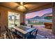 The covered patio offers views, and access to an outdoor kitchen at 32359 N 129Th Dr, Peoria, AZ 85383