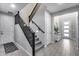 Staircase features carpeted steps, and opens to a hallway with tiled floors at 32359 N 129Th Dr, Peoria, AZ 85383