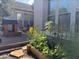 Charming backyard with garden bed, playhouse, and string lights for outdoor enjoyment at 3765 N Denny Way, Buckeye, AZ 85396