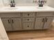 Bathroom vanity with double sinks, gray cabinets, modern black fixtures, and light counter at 3765 N Denny Way, Buckeye, AZ 85396
