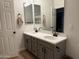 Bathroom featuring a double sink vanity, grey cabinets, and light-colored walls at 3765 N Denny Way, Buckeye, AZ 85396