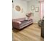 A charming bedroom that features a daybed with stuffed animals in a net, offering a cozy and playful retreat at 3765 N Denny Way, Buckeye, AZ 85396
