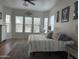 Bright bedroom with a large window, neutral tones, and modern furniture at 3765 N Denny Way, Buckeye, AZ 85396