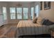 Bright bedroom with a large window, neutral tones, and modern furniture at 3765 N Denny Way, Buckeye, AZ 85396