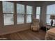 Bedroom with a large window and comfortable chair at 3765 N Denny Way, Buckeye, AZ 85396