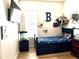 Cozy bedroom featuring a bed, playful decor, and plenty of natural light at 3765 N Denny Way, Buckeye, AZ 85396
