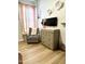 Cozy bedroom featuring a dresser with changing table, a comfy chair, and soft pink accents for a relaxing space at 3765 N Denny Way, Buckeye, AZ 85396