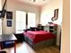 Nicely appointed bedroom with storage bed, desk, and sporty accents for a youthful and functional space at 3765 N Denny Way, Buckeye, AZ 85396