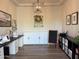 Bright craft room with ample storage, a sewing station and a decorative chandelier at 3765 N Denny Way, Buckeye, AZ 85396