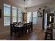 Bright dining room with a chandelier, a wine rack, and natural light from large windows at 3765 N Denny Way, Buckeye, AZ 85396