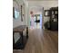 Inviting entryway with beautiful wood-look floors and arched doorways, leading to the living spaces at 3765 N Denny Way, Buckeye, AZ 85396
