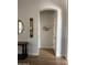 Charming entryway with a wood table, a decorative mirror, and arched doorways at 3765 N Denny Way, Buckeye, AZ 85396