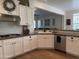 Stylish kitchen featuring white cabinets, granite countertops, and stainless steel appliances at 3765 N Denny Way, Buckeye, AZ 85396