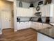 Well-lit kitchen with white cabinetry, subway tile backsplash, and granite countertops at 3765 N Denny Way, Buckeye, AZ 85396