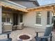 Cozy outdoor patio with comfortable seating, string lights, and a fire pit for evening relaxation at 3765 N Denny Way, Buckeye, AZ 85396