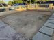 Backyard featuring low walls, pavers, and desert landscaping at 3946 W Holly St, Phoenix, AZ 85009