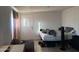 Bedroom with queen bed, exterior door and a small window for natural light at 3946 W Holly St, Phoenix, AZ 85009