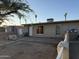 Exterior showcases a single-story home with a small yard, minimal landscaping, and a neutral color palette at 3946 W Holly St, Phoenix, AZ 85009