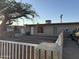 Cozy home exterior features a quaint yard and neutral-toned facade, with mature trees providing shade at 3946 W Holly St, Phoenix, AZ 85009