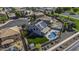 Aerial view of a home featuring a private pool, green lawn, solar panels, and landscaped backyard at 41581 W Somerset Dr, Maricopa, AZ 85138