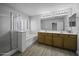 The bathroom showcases a glass shower, a soaking tub, and a double vanity at 41581 W Somerset Dr, Maricopa, AZ 85138