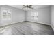 A bedroom has shutters on the windows that let in lots of light at 41581 W Somerset Dr, Maricopa, AZ 85138
