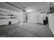 Spacious garage with ample storage racks at 41581 W Somerset Dr, Maricopa, AZ 85138
