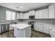 Modern kitchen with stainless steel appliances, countertops, and mosaic backsplash at 41581 W Somerset Dr, Maricopa, AZ 85138