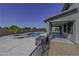 Backyard pool and patio area with outdoor seating at 41581 W Somerset Dr, Maricopa, AZ 85138