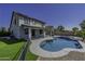 Home exterior showcasing a well-maintained pool and patio area at 41581 W Somerset Dr, Maricopa, AZ 85138