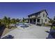 Backyard with pool, spa, covered patio and lush landscaping at 41581 W Somerset Dr, Maricopa, AZ 85138