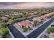 Birds eye view of a home with a red tile roof and well manicured landscaping in a residential area at 4208 E Hamblin Dr, Phoenix, AZ 85050