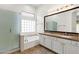 Bathroom showcasing a double sink vanity, soaking tub, and glass-enclosed shower at 4208 E Hamblin Dr, Phoenix, AZ 85050