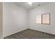 Bedroom with ceiling fan, carpeted floor, and bright window at 4208 E Hamblin Dr, Phoenix, AZ 85050