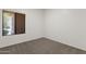 Cozy bedroom featuring neutral carpet and a window with blinds at 4208 E Hamblin Dr, Phoenix, AZ 85050