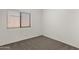 Bedroom with neutral carpet, large window, and ample natural light at 4208 E Hamblin Dr, Phoenix, AZ 85050