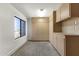 This garage has storage, a large window, and a smooth concrete floor at 4208 E Hamblin Dr, Phoenix, AZ 85050