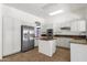 Well-lit kitchen featuring white cabinets, stainless steel appliances, and granite countertops at 4208 E Hamblin Dr, Phoenix, AZ 85050