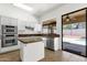 Bright kitchen with stainless steel appliances, granite counters, and access to the backyard at 4208 E Hamblin Dr, Phoenix, AZ 85050