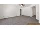 Spacious living room with neutral carpet, white walls, and archways leading to other rooms in the home at 4208 E Hamblin Dr, Phoenix, AZ 85050