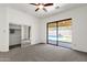 Spacious main bedroom with sliding glass doors overlooking the pool and a walk-in closet at 4208 E Hamblin Dr, Phoenix, AZ 85050