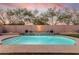 Beautiful backyard pool with elegant lighting at sunset at 4208 E Hamblin Dr, Phoenix, AZ 85050