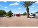 Expansive backyard with mature trees, gravel landscaping, and a serene atmosphere at 427 S 80Th Way, Mesa, AZ 85208