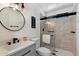 Modern bathroom featuring a glass-enclosed shower, sleek vanity, and contemporary fixtures at 427 S 80Th Way, Mesa, AZ 85208