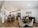 Bright kitchen features an island with seating and stainless steel appliances, adjacent to a dining area with a round table at 427 S 80Th Way, Mesa, AZ 85208